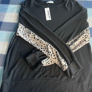 Black casual long sleeve. Sleeves are half leopard print